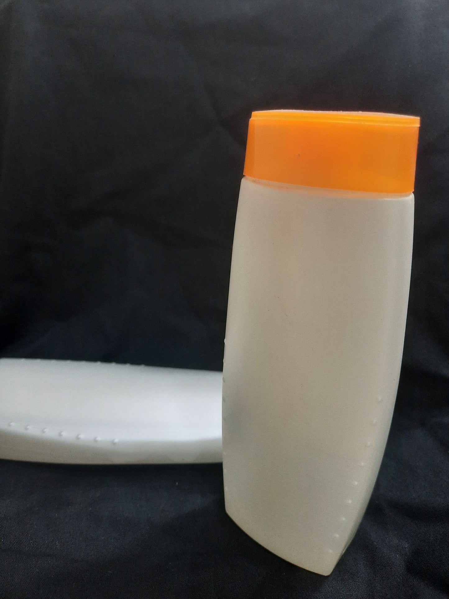 Orange White Shampoo Bottle